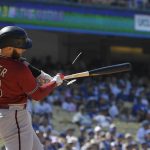 
              Arizona Diamondbacks' Christian Walker breaks his bat as he pops out during the seventh inning of a baseball game against the Los Angeles Dodgers Wednesday, May 18, 2022, in Los Angeles. (AP Photo/Mark J. Terrill)
            