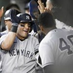 
              New York Yankees' Jose Trevino, left, celebrates his three-run home run with teammate Luis Severino (40) and others in the dugout during the fourth inning of a baseball game against the Baltimore Orioles, Monday, May 16, 2022, in Baltimore. (AP Photo/Nick Wass)
            