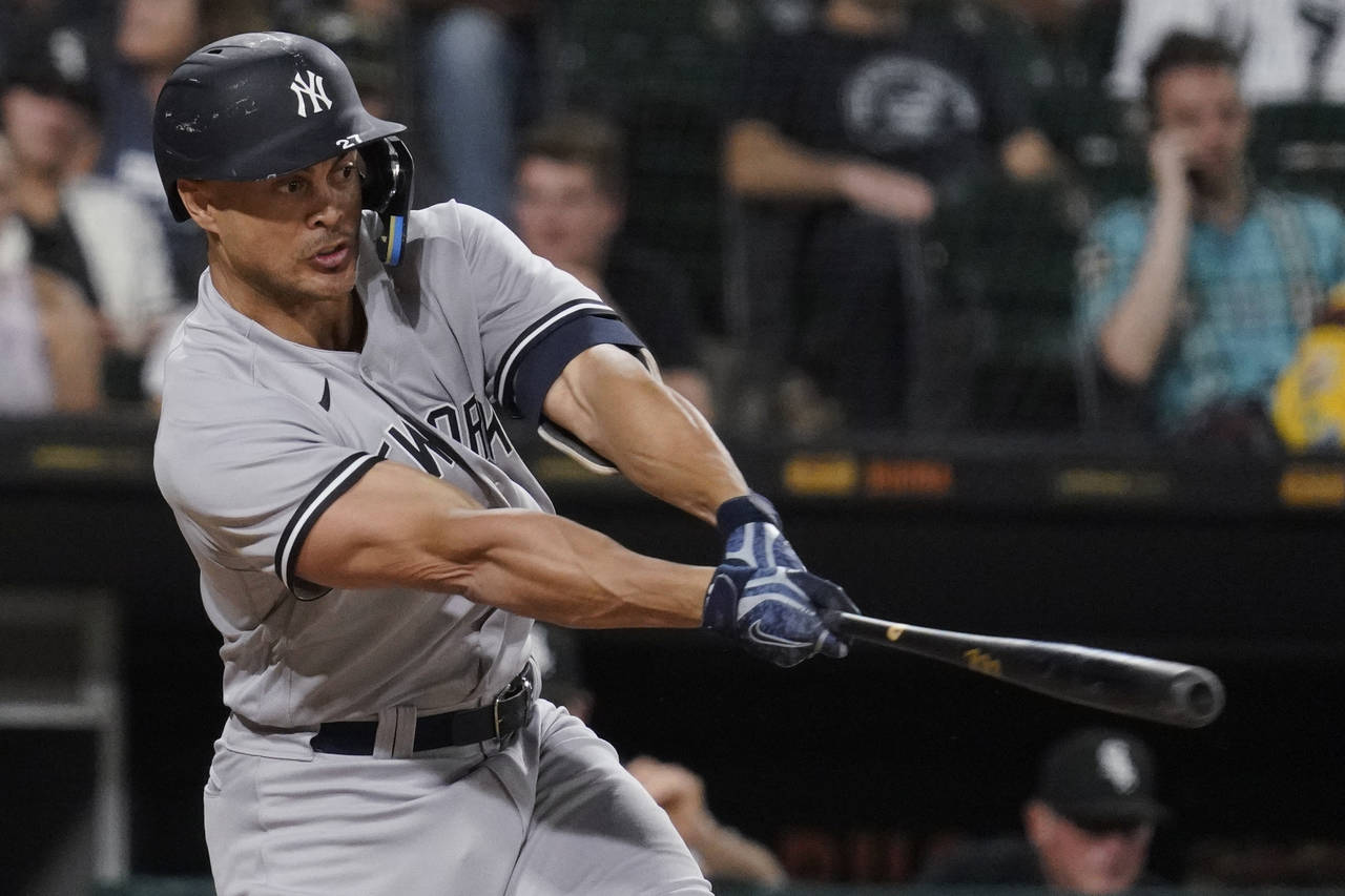 New York Yankees' Giancarlo Stanton hits a two-run single against the Chicago White Sox during the ...
