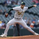 
              Oakland Athletics starter Zach Logue delivers a pitch during the first inning of a baseball game against the Seattle Mariners, Monday, May 23, 2022, in Seattle. (AP Photo/Stephen Brashear)
            