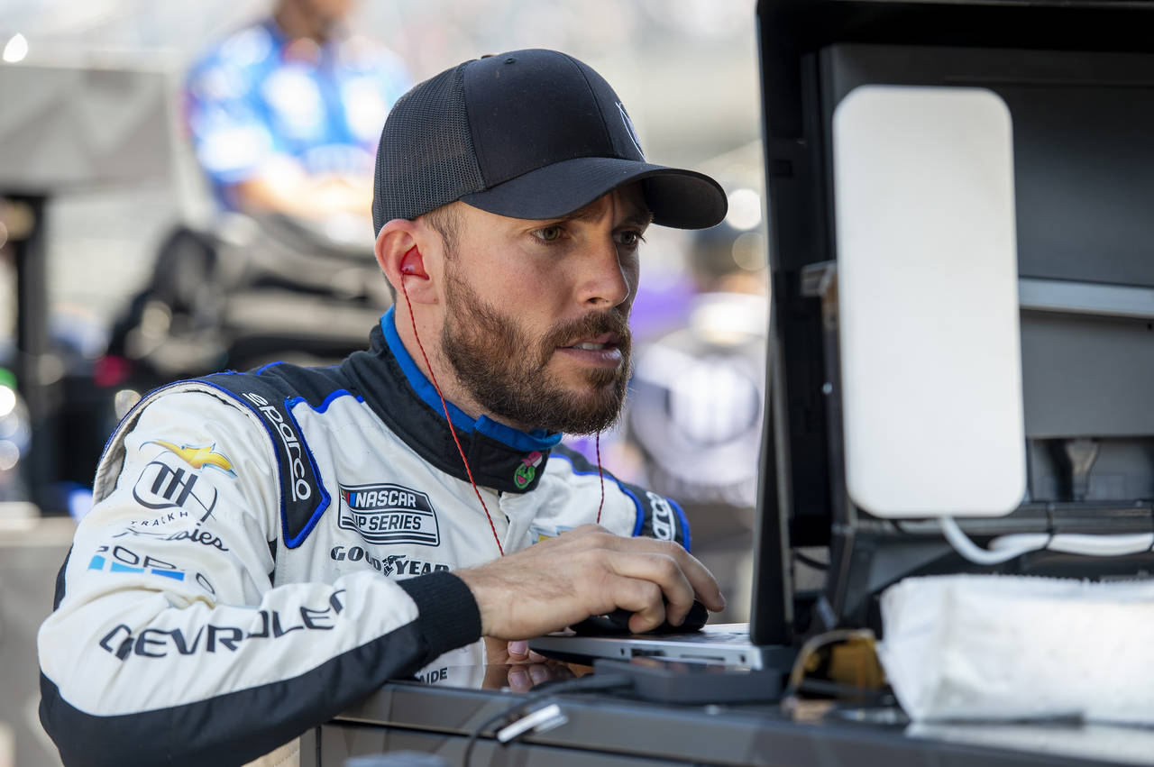 Ross Chastain looks at data on a computer during a NASCAR Xfinity Series auto race practice at Dove...