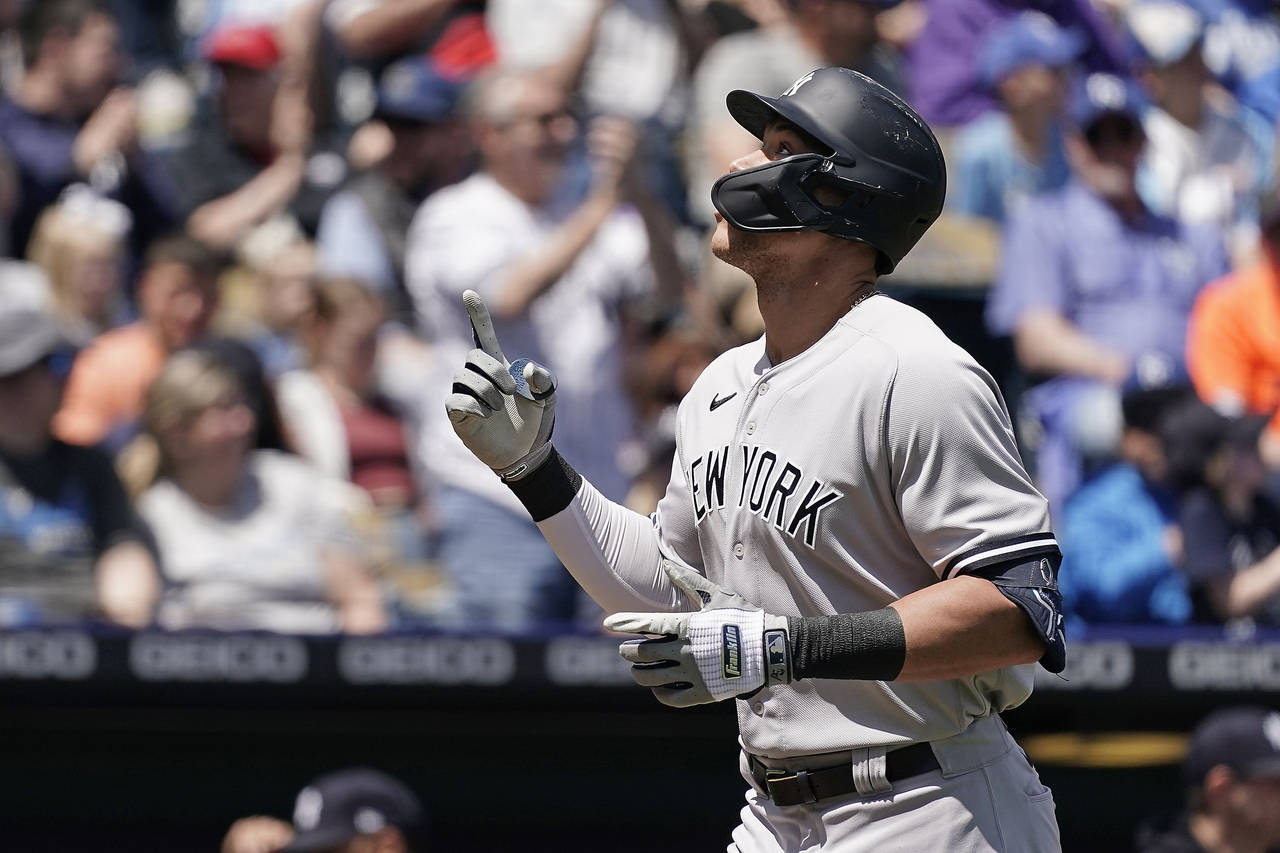 New York Yankees' Aaron Judge celebrates as he crosses the plate after hitting a solo home run duri...