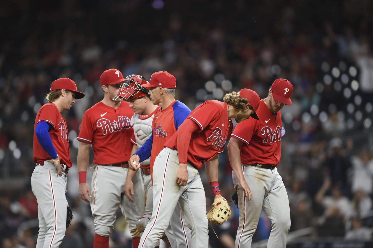 Philadelphia Phillies manager Joe Girardi removes starting pitcher Aaron Nola, right, for relief pi...