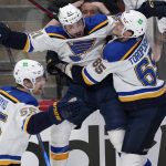 
              St. Louis Blues center Tyler Bozak, middle, celebrates his overtime goal against the Colorado Avalanche with right wing Alexei Toropchenko in Game 5 of an NHL hockey Stanley Cup second-round playoff series Wednesday, May 25, 2022, in Denver. At left is Colton Parayko. (AP Photo/David Zalubowski)
            
