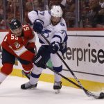 
              Tampa Bay Lightning defenseman Victor Hedman (77) and Florida Panthers center Noel Acciari (55) battle for the puck during the second period of Game 1 of an NHL hockey second-round playoff series Tuesday, May 17, 2022, in Sunrise, Fla. (AP Photo/Reinhold Matay)
            