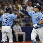 
              Tampa Bay Rays' Ji-Man Choi, right, celebrates with teammate Manuel Margot after hitting a home run against the New York Yankees during the second inning of a baseball game Sunday, May 29, 2022, in St. Petersburg, Fla. (AP Photo/Scott Audette)
            