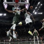 
              Milwaukee Bucks' Giannis Antetokounmpo blocks a shot of Boston Celtics' Marcus Smart during the second half of Game 6 of an NBA basketball Eastern Conference semifinals playoff series Friday, May 13, 2022, in Milwaukee. The Celtics won 108-95 to tie the series at 3-3. (AP Photo/Morry Gash)
            