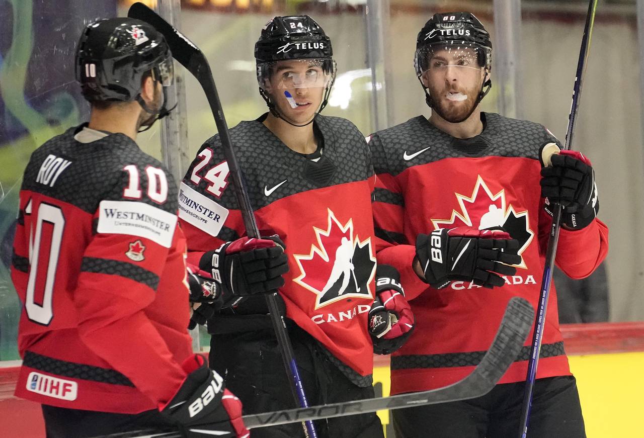 Dylan Cozens of Canada, center, celebrate after scoring a goal during the group A Hockey World Cham...