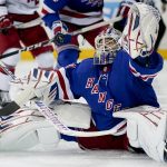 
              New York Rangers goaltender Igor Shesterkin (31) makes a save in the first period of Game 4 of an NHL hockey Stanley Cup second-round playoff series, Tuesday, May 24, 2022, in New York. (AP Photo/John Minchillo)
            