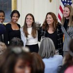 
              FILE - Briana Scurry, from left, former member of the U.S. Women's National Team, Margaret 'Midge' Purce, member of the U.S. Women's National Team, Kelley O'Hara, member of the U.S. Women's National Team, Julie Foudy, former member of the U.S. Women's National Team, and Cindy Parlow Cone, President of U.S. Soccer, pose for a photo with House Speaker Nancy Pelosi of Calif., before an event to celebrate Equal Pay Day and Women's History Month in the East Room of the White House, Tuesday, March 15, 2022, in Washington.  The U.S. women's national team has not only been wildly successful on the field, the players have also been unabashedly outspoken, using their platform to advocate for equal rights for themselves and others. (AP Photo/Patrick Semansky, File)
            