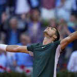 
              Carlos Alcaraz celebrates after defeating Novak Djokovic during a men's semifinal at the Mutua Madrid Open tennis tournament in Madrid, Spain, Saturday, May 7, 2022. (AP Photo/Manu Fernandez)
            