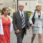 
              FILE - Former UCLA gynecologist Dr. James Heaps, center, with his wife Deborah, left, and defense attorney Tracy Green leave Los Angeles Superior Court, on June 26, 2019. The University of California has agreed to pay $375 million to more than 300 women who said they were sexually abused by a longtime UCLA gynecologist. The announcement Tuesday, May 24, 2022, brings total payouts by the university in lawsuits against Dr. Heap to nearly $700 million. That's the largest amount paid by a public university in a wave of sexual misconduct scandals involving campus doctors. (AP Photo/Damian Dovarganes, File)
            
