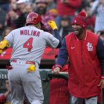 
              St. Louis Cardinals' Yadier Molina (4) is congratulated by Albert Pujols, right, after hitting a solo home run against the San Francisco Giants during the third inning of a baseball game Thursday, May 5, 2022, in San Francisco. (AP Photo/Tony Avelar)
            