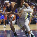 
              Connecticut Sun center Brionna Jones, left, and Dallas Wings forward Kayla Thornton (6) vie for the ball during a WNBA basketball game Tuesday, May 24, 2022, in Uncasville, Conn. (Sean D. Elliot/The Day via AP)
            