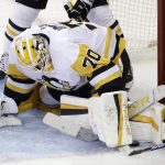 
              Pittsburgh Penguins goaltender Louis Domingue makes a save against the New York Rangers during the second overtime of Game 1 of an NHL hockey Stanley Cup first-round playoff series Tuesday, May 3, 2022, in New York. (AP Photo/Adam Hunger)
            