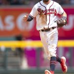 
              Atlanta Braves shortstop Dansby Swanson tags second base for an out during the 10th inning of a baseball game against the San Diego Padres, Sunday, May 15, 2022, in Atlanta. (AP Photo/Hakim Wright Sr)
            