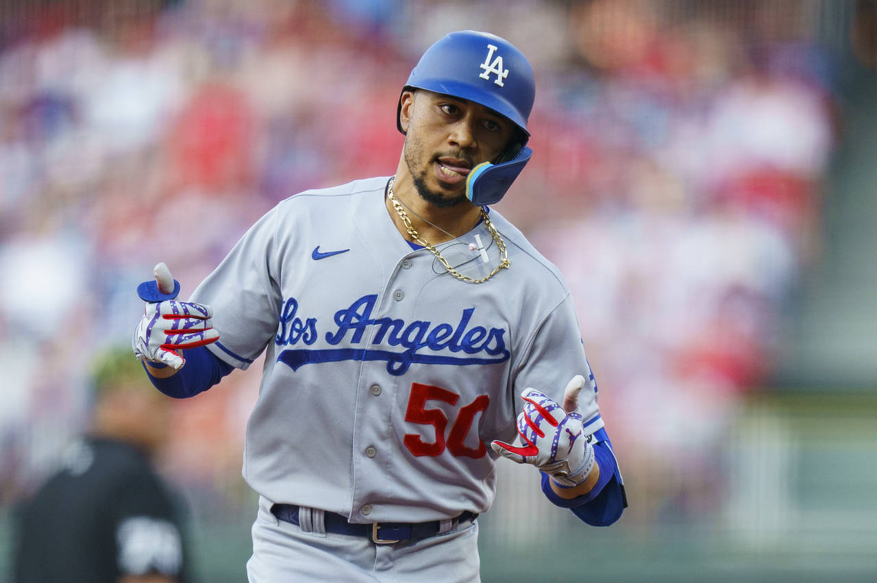 Los Angeles Dodgers' Mookie Betts reacts to hitting a solo home run against the Philadelphia Philli...