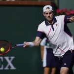 
              FILE - John Isner returns to Diego Schwartzman, of Argentina, at the BNP Paribas Open tennis tournament Tuesday, March 15, 2022, in Indian Wells, Calif. At 37, John Isner is just happy to be back on tour in Europe with his wife and three kids. No longer dreaming of a Grand Slam title, he’s trying to make the back end of his tennis career not seem “like such a job.”
Yet there’s serious business coming up Wednesday, May 11 with a second-round matchup against 10-time champion Rafael Nadal in the second round of the Italian Open. (AP Photo/Marcio Jose Sanchez, file)
            