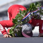 
              Marcus Ericsson, of Sweden, celebrates after winning the Indianapolis 500 auto race by kissing the yard of bricks at Indianapolis Motor Speedway in Indianapolis, Sunday, May 29, 2022. (AP Photo/AJ Mast)
            