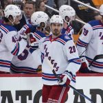 
              New York Rangers' Chris Kreider (20) returns to the bench after scoring against the Pittsburgh Penguins during the second period in Game 6 of an NHL hockey Stanley Cup first-round playoff series in Pittsburgh, Friday, May 13, 2022. (AP Photo/Gene J. Puskar)
            