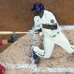 
              Milwaukee Brewers' Lorenzo Cain is hit by a pitch during the second inning of a baseball game against the Cincinnati Reds Wednesday, May 4, 2022, in Milwaukee. (AP Photo/Morry Gash)
            