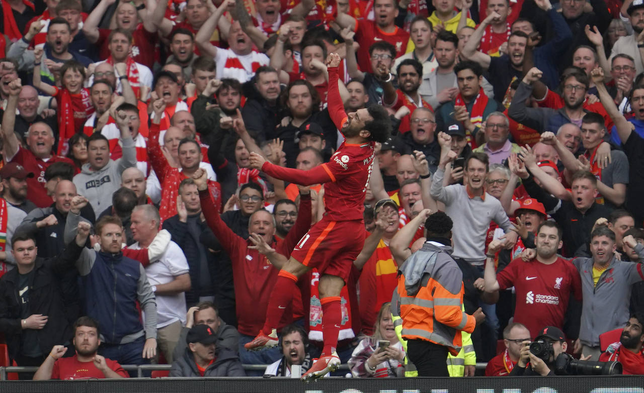 Liverpool's Mohamed Salah celebrates after scoring his goal during the Premier League soccer match ...