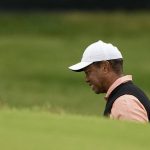 
              Tiger Woods grimaces on the 18th hole during the third round of the PGA Championship golf tournament at Southern Hills Country Club, Saturday, May 21, 2022, in Tulsa, Okla. (AP Photo/Matt York)
            