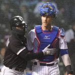 
              Chicago White Sox's Josh Harrison, left, pats Chicago Cubs catcher Yan Gomes after Harrison was hit by a pitch from relief pitcher Keegan Thompson during the fifth inning of a baseball game Tuesday, May 3, 2022, in Chicago. (AP Photo/Charles Rex Arbogast)
            