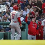 
              Los Angeles Angels manager Joe Maddon, center, celebrates the two-run single by Jared Walsh that drove in Shohei Ohtani (17) and David Fletcher (22) during the eighth inning of a baseball game against the Boston Red Sox, Thursday, May 5, 2022, in Boston. (AP Photo/Michael Dwyer)
            