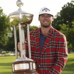 
              Sam Burns holds the trophy after winning the Charles Schwab Challenge golf tournament at the Colonial Country Club in Fort Worth, Texas, Sunday, May 29, 2022. (AP Photo/LM Otero)
            