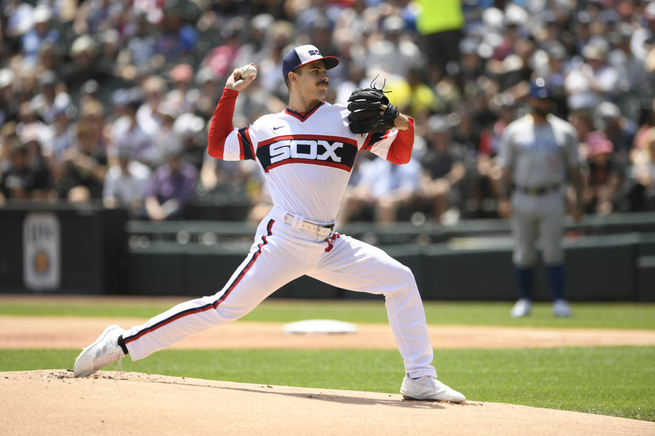 Chicago White Sox starter Dylan Cease delivers a pitch during the first inning of a baseball game a...