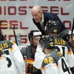 
              Germany's head coach Toni Soderholm talks to his players during the group A Hockey World Championship match between Kazakhstan and Germany in Helsinki, Finland, Sunday May 22 2022. (AP Photo/Martin Meissner)
            