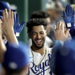 
              Kansas City Royals' MJ Melendez celebrates in the dugout after hitting a two-run home run during the eighth inning of a baseball game against the Chicago White Sox Wednesday, May 18, 2022, in Kansas City, Mo. (AP Photo/Charlie Riedel)
            