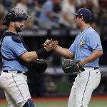 
              Tampa Bay Rays catcher Mike Zunino, left, celebrates with relief pitcher J.P. Feyereisen after a baseball game against the New York Yankees, Sunday, May 29, 2022, in St. Petersburg, Fla. (AP Photo/Scott Audette)
            