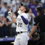 
              Colorado Rockies' Sam Hilliard gestures as he crosses home plate after hitting a three-run home run off Kansas City Royals starting pitcher Carlos Hernandez during the third inning of a baseball game Saturday, May 14, 2022, in Denver. (AP Photo/David Zalubowski)
            