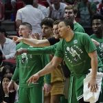 
              Boston Celtics players cheer the team from the bench during the second half of Game 2 of the NBA basketball Eastern Conference finals playoff series against the Miami Heat, Thursday, May 19, 2022, in Miami. (AP Photo/Lynne Sladky)
            