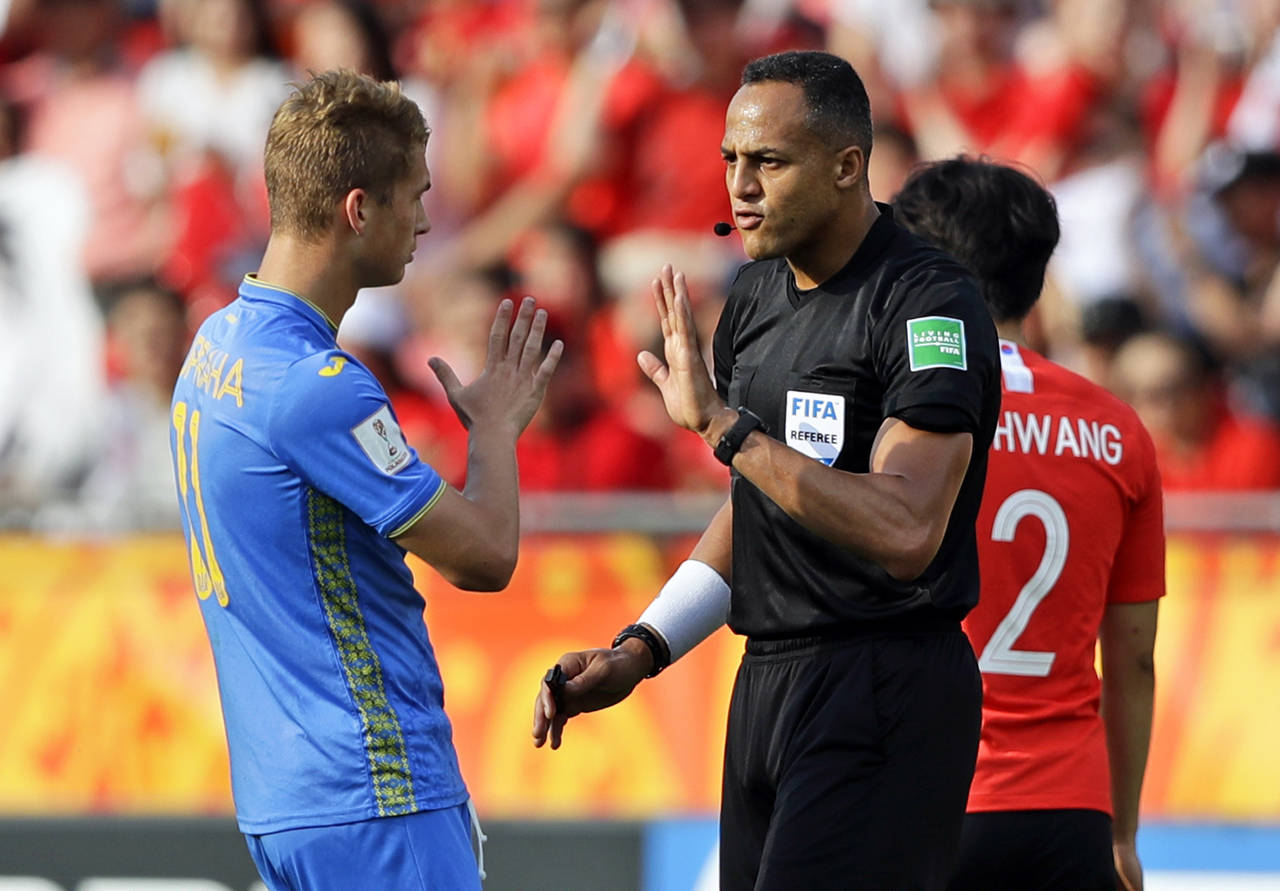 FILE - Referee Ismail Elfath gestures to Ukraine's Vladyslav Supriaha during the final match betwee...