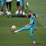 
              Real Madrid's Karim Benzema controls the ball during a Media Opening day training session in Madrid, Spain, Tuesday, May 24, 2022. Real Madrid will play Liverpool in Saturday's Champions League soccer final in Paris. (AP Photo/Manu Fernandez)
            