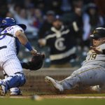 
              Chicago Cubs catcher Willson Contreras (40) tags out Pittsburgh Pirates' Daniel Vogelbach (19) at home plate during the fourth inning of a baseball game Tuesday, May 17, 2022, in Chicago. (AP Photo/Paul Beaty)
            