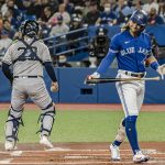 
              Toronto Blue Jays shortstop Bo Bichette (11) reacts after striking out during the first inning of a baseball game against the New York Yankees, Monday, May 2, 2022 in Toronto. (Christopher Katsarov/The Canadian Press via AP)
            