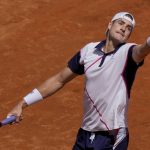 
              John Isner returns the ball to Rafael Nadal during their match at the Italian Open tennis tournament, in Rome, Wednesday, May 11, 2022. (AP Photo/Andrew Medichini)
            