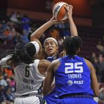 
              Dallas Wings forward Kayla Thornton (6) fouls Connecticut Sun center Brionna Jones (42) during the first half of a WNBA basketball game Tuesday, May 24, 2022 at Mohegan Sun Arena in Uncasville, Conn.  (Sean D. Elliot/The Day via AP)
            