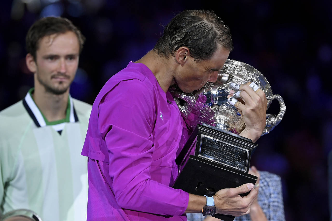 FILE - Rafael Nadal of Spain kisses the Norman Brookes Challenge Cup after defeating Daniil Medvede...