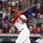 
              Cincinnati Reds' Aristides Aquino watches his two-run home run against the Chicago Cubs during the sixth inning of a baseball game in Cincinnati, Monday, May 23, 2022. (AP Photo/Paul Vernon)
            