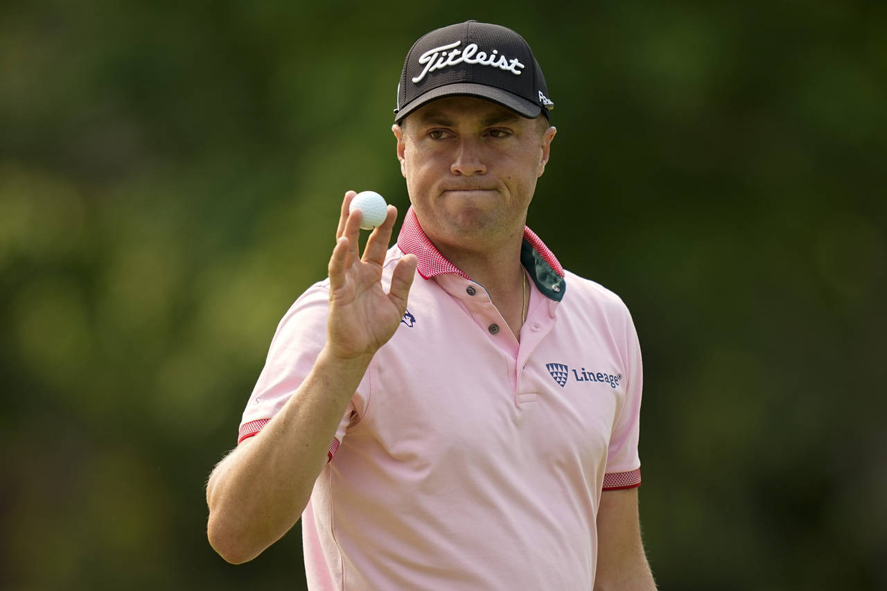 FILE -  Justin Thomas waves after making a putt on the 14th hole during the final round of the PGA ...