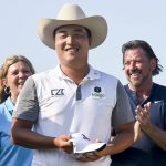 
              K.H. Lee, of South Korea, smiles after his was given a custom-made cowboy hat after winning the AT&T Byron Nelson golf tournament in McKinney, Texas, on Sunday, May 15, 2022. (AP Photo/Emil Lippe)
            