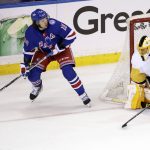 
              New York Rangers left wing Artemi Panarin (10) looks to pass the puck past Pittsburgh Penguins goaltender Casey DeSmith in overtime of Game 1 of an NHL hockey Stanley Cup first-round playoff series Tuesday, May 3, 2022, in New York. (AP Photo/Adam Hunger)
            