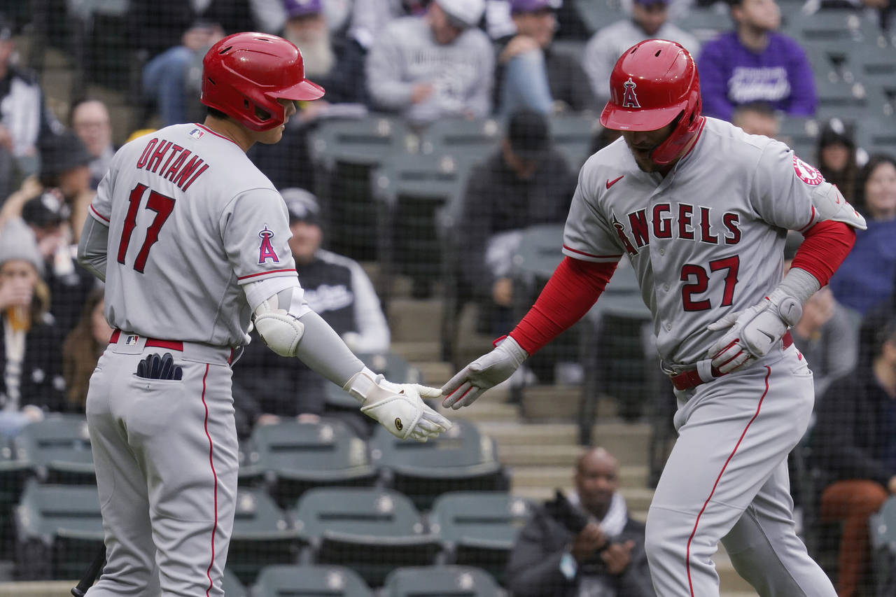 Los Angeles Angels' Mike Trout, right, celebrates with Shohei Ohtani, of Japan, after hitting a sol...