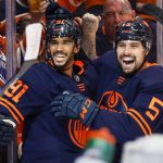 
              Edmonton Oilers winger Evander Kane, left, celebrates his goal with teammate defenseman Cody Ceci during second period NHL second round playoff hockey action against the Calgary Flames in Edmonton, Alberta, Sunday, May 22, 2022.  (Jeff McIntosh/The Canadian Press via AP)
            