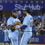 
              Toronto Blue Jays closing pitcher Jordan Romano (68) and first baseman Vladimir Guerrero Jr., left, celebrate after they defeated the Houston Astros in a baseball game in Toronto, Sunday, May 1, 2022. (Christopher Katsarov/The Canadian Press via AP)
            